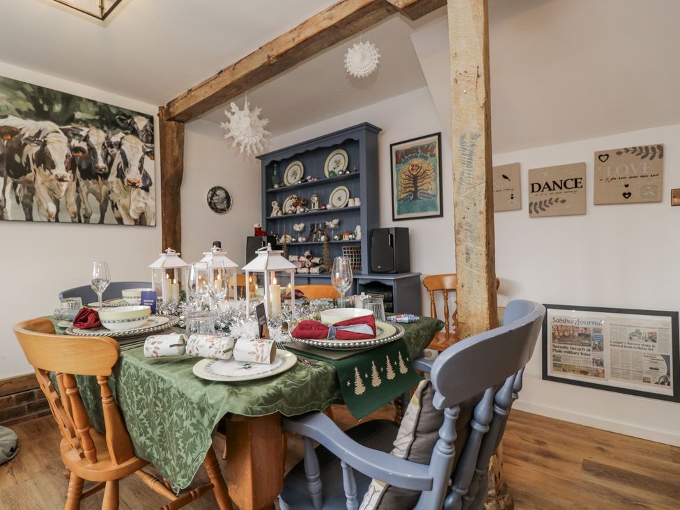 A dining room with a decorated table at The Old Byre in Woodfalls