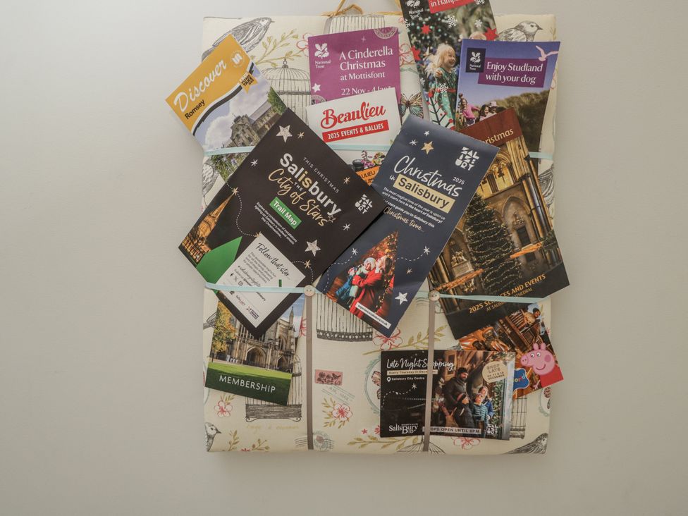 A collection of event brochures and maps at The Old Byre in Woodfalls