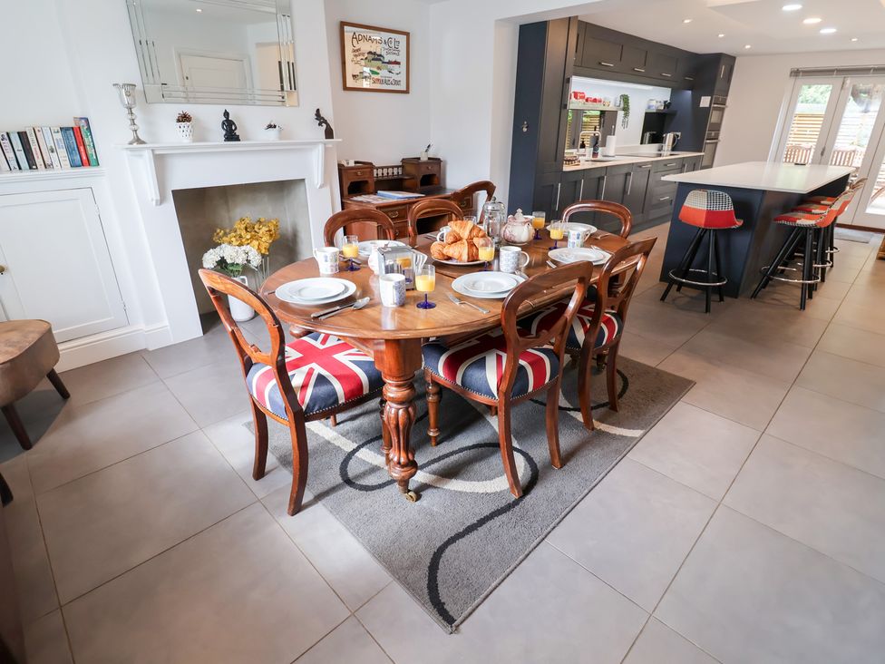 A dining room with a table set for breakfast at Cavan Cottage Yoxford
