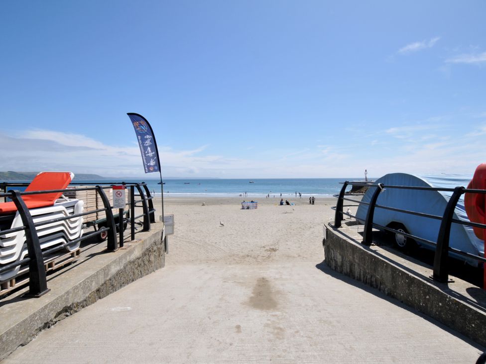 A beach with sun loungers and a view of the sea at 3 River View Looe