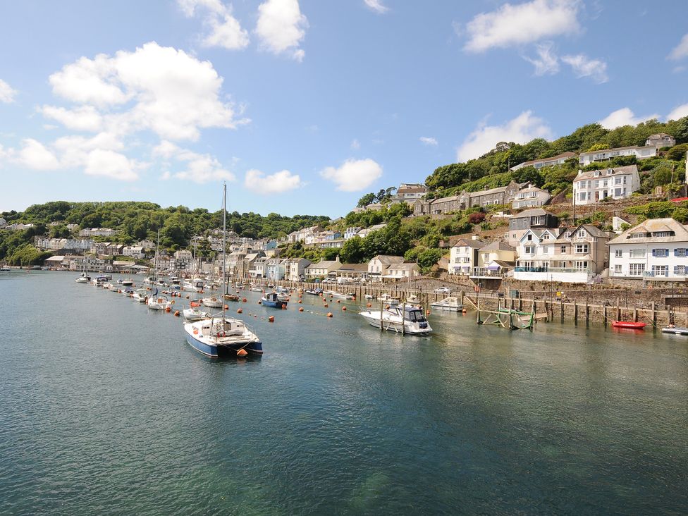 A waterfront with boats and houses at 3 River View Looe