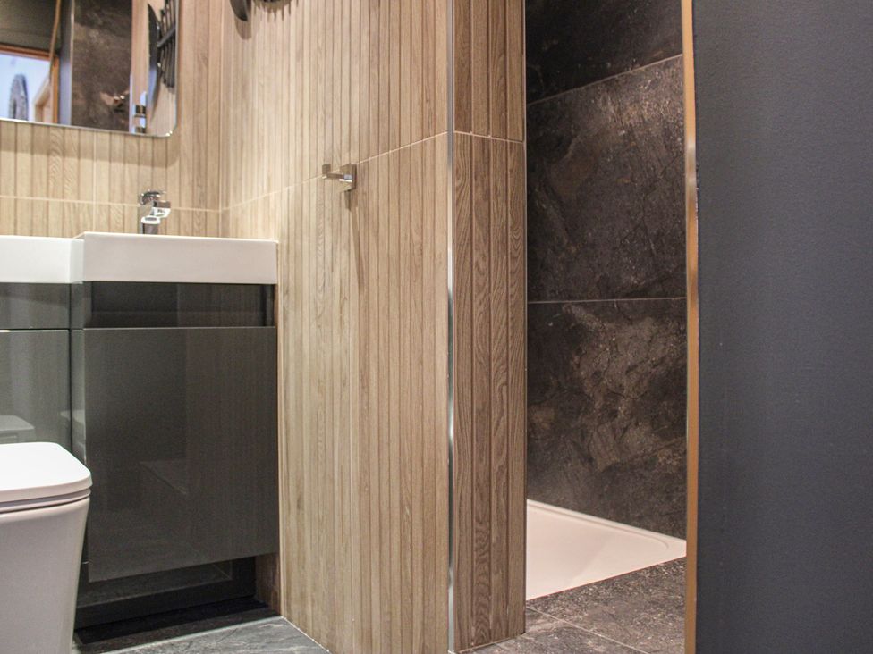 A bathroom with a toilet and sink at 5 Harbour Yard in Salcombe