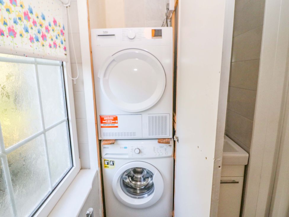 A washing machine and dryer in a laundry room at Whispering Pines, Durrus, County Cork