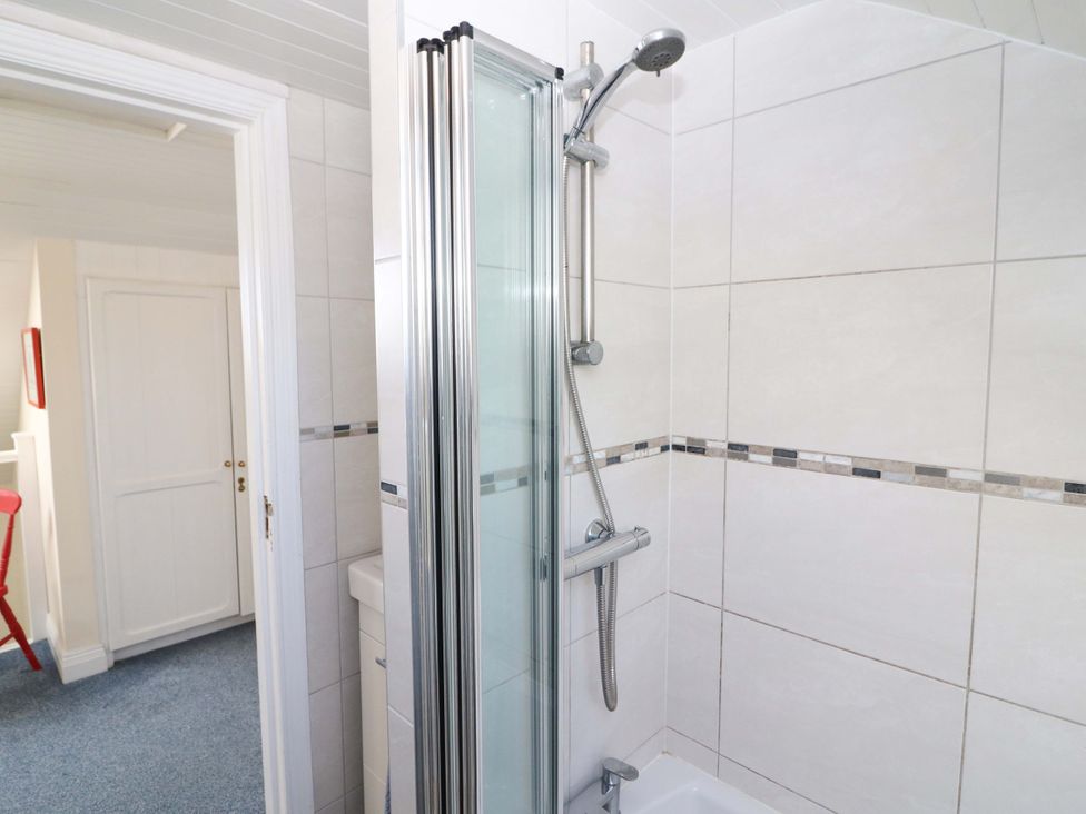 A bathroom with a shower and sink at Whispering Pines, Durrus, County Cork