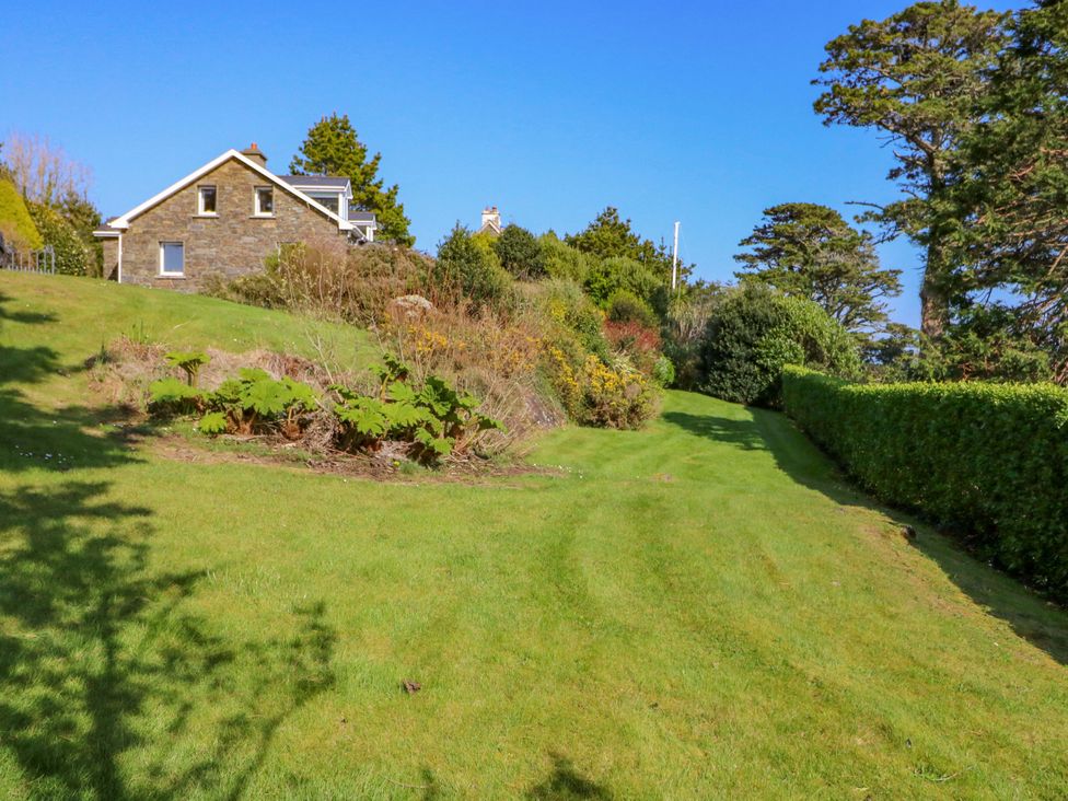 A house and garden with a pathway at Whispering Pines in Durrus, County Cork