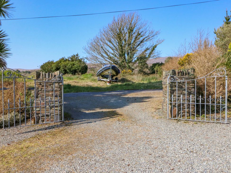 An outdoor image showing gates and a boat at Whispering Pines in Durrus, County Cork