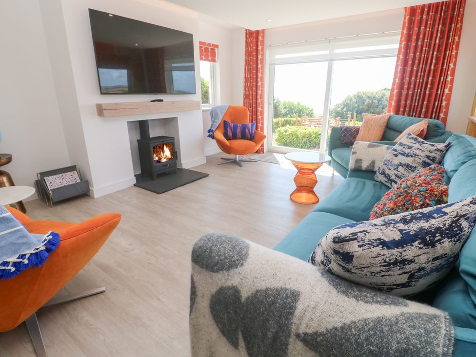 A living room with a television and fireplace at Shearwater
