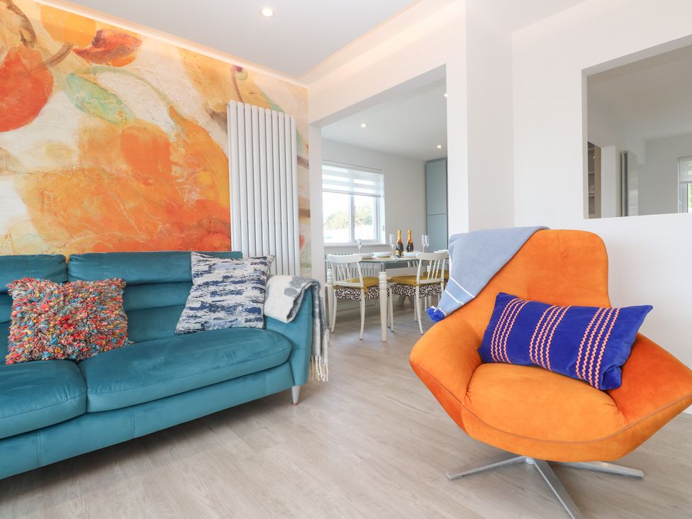 A living room with a sofa and armchair at Shearwater