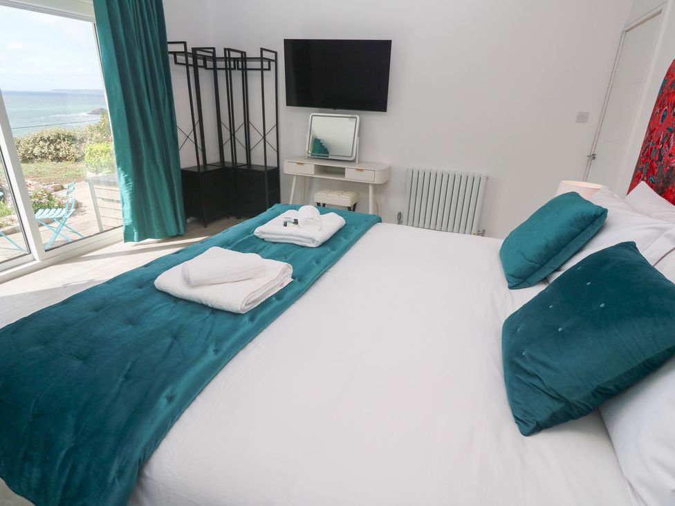 A bedroom with a bed and television at Shearwater