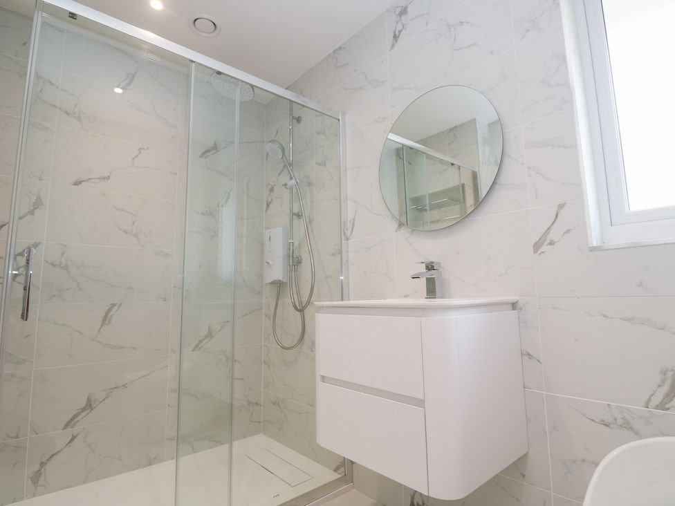 A bathroom featuring a shower and sink at Shearwater
