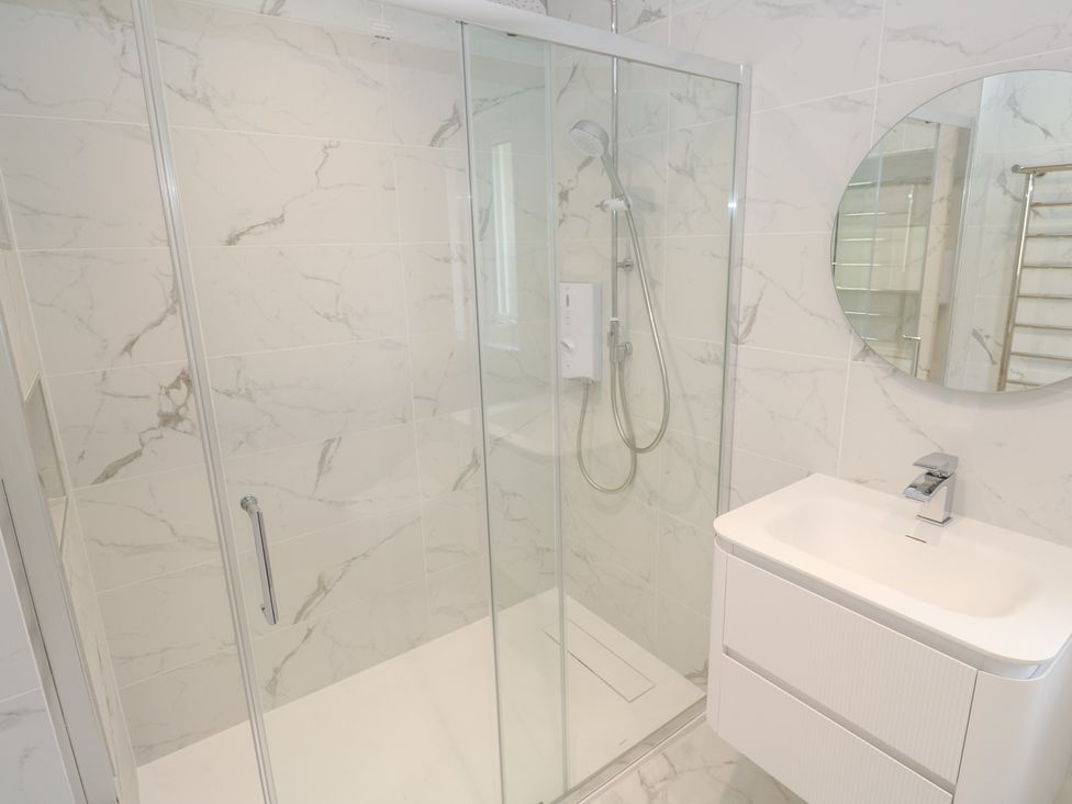 A shower and sink in a bathroom at Shearwater