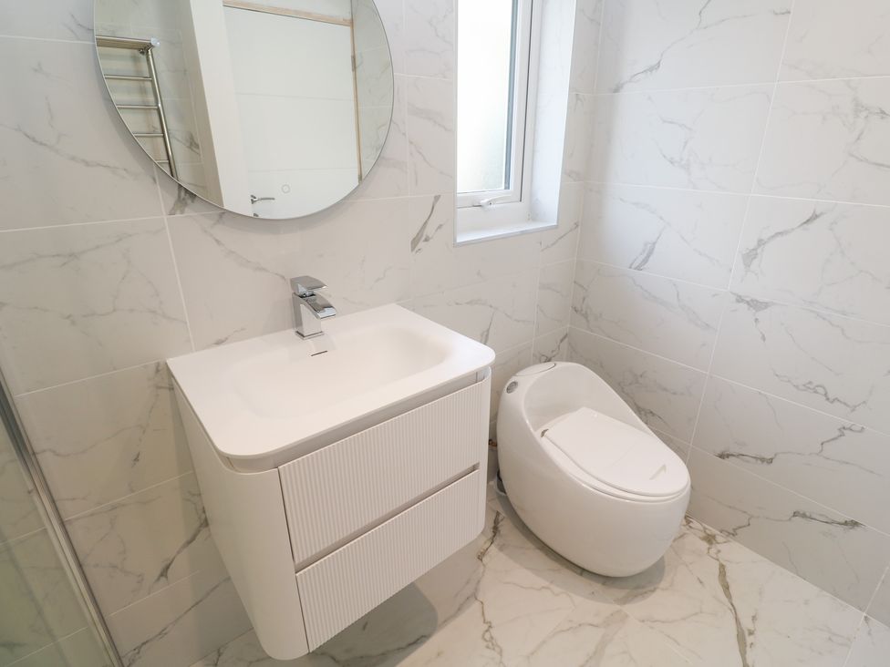A bathroom with a sink and toilet at Shearwater