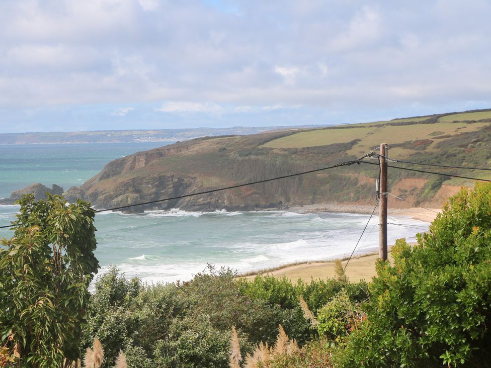 A view of the ocean and cliffs with beach in the distance at Shearwater