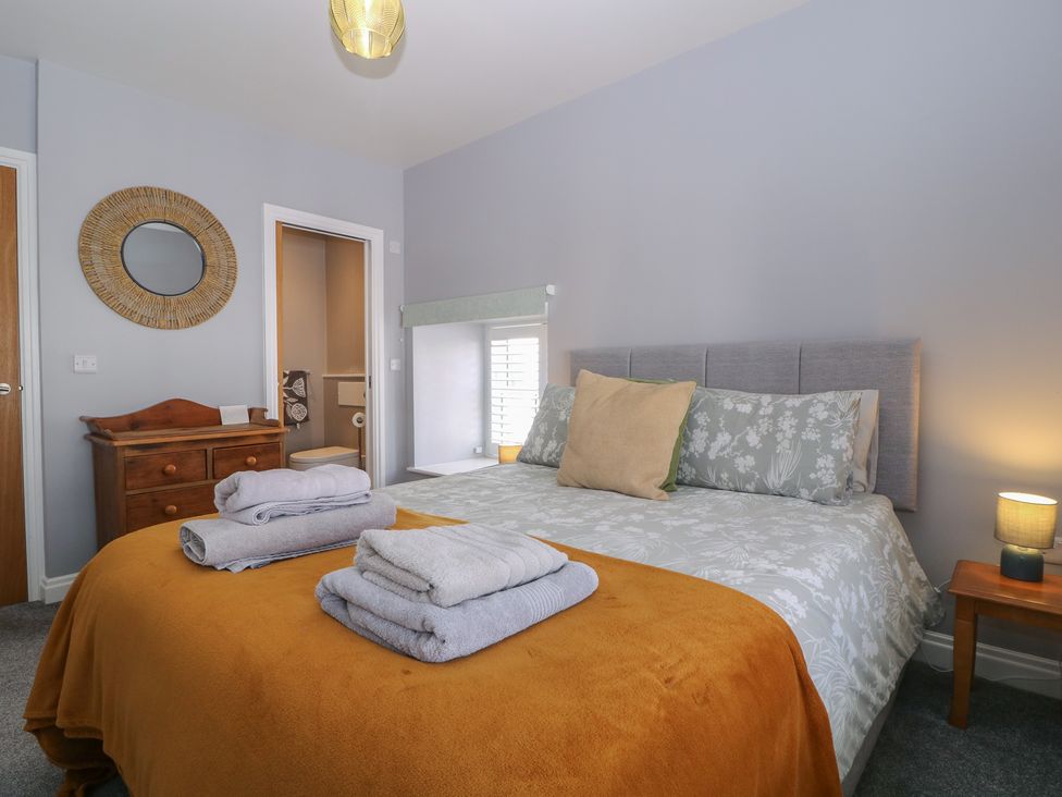 A bedroom with a bed and chest of drawers at 19 Lion Street in Hay-On-Wye