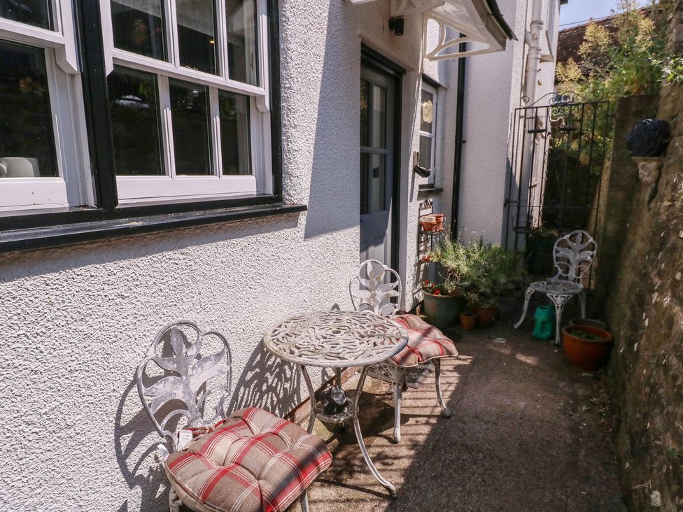An outdoor seating area with a table and chairs at 19 Lion Street Hay-On-Wye