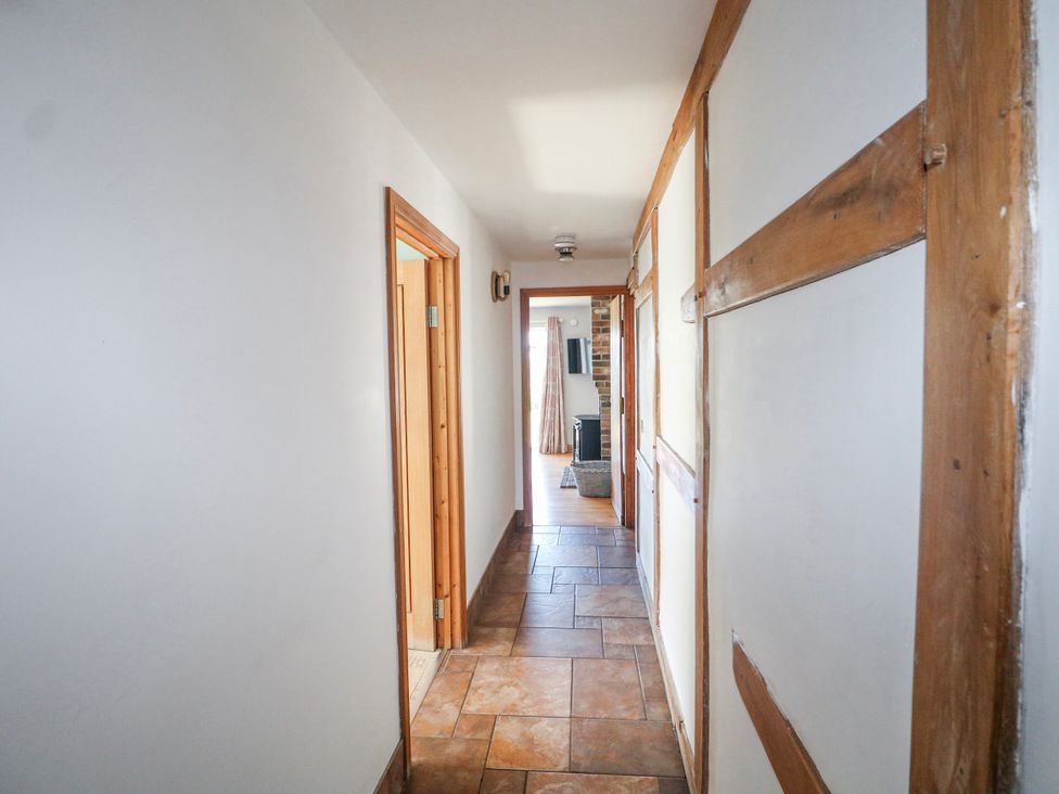 A hallway with tiles and doors at 50 Harbour Road Pagham