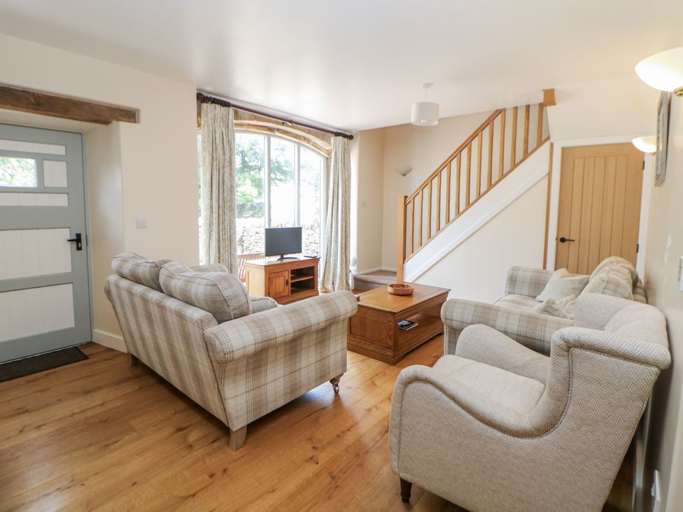 A living room with two sofas and a coffee table at The Coach House at Mayfurlong Farm Grindon near Waterhouses