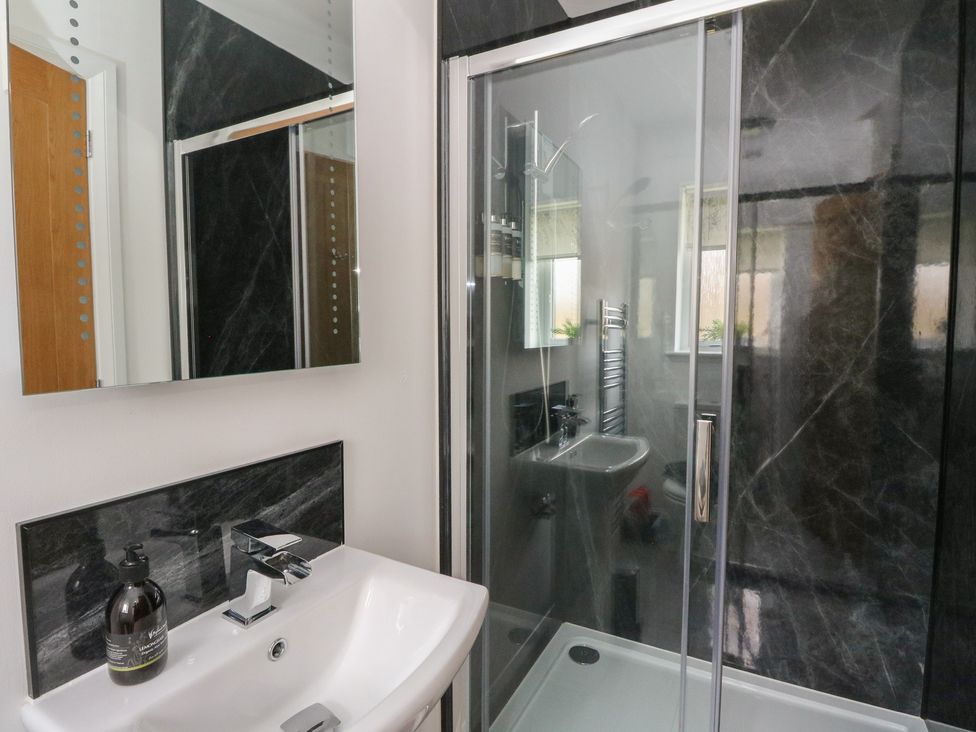 A bathroom with a sink and shower at Eildan in Fort William