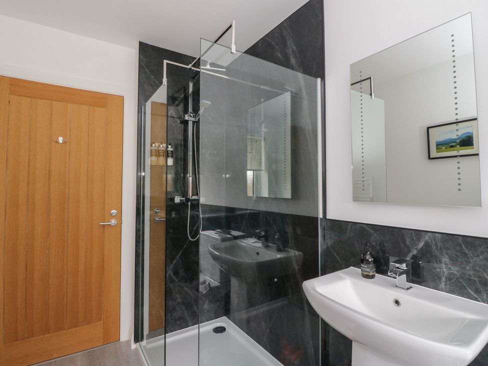 A bathroom with a shower and sink at Eildan in Fort William