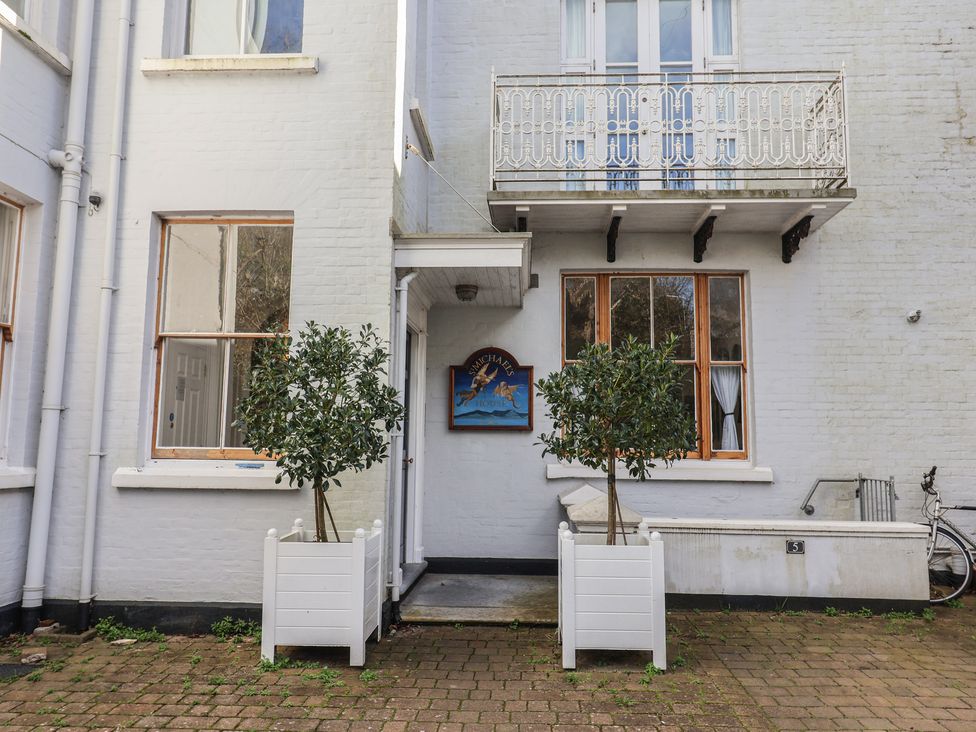 An outdoor area with planters and a bicycle at 2 St Michaels House in Lyme Regis