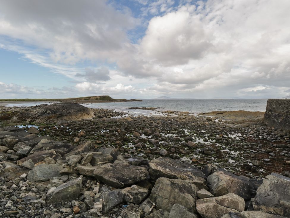 A rocky shore next to the sea at Sea View House in Tully, County Galway
