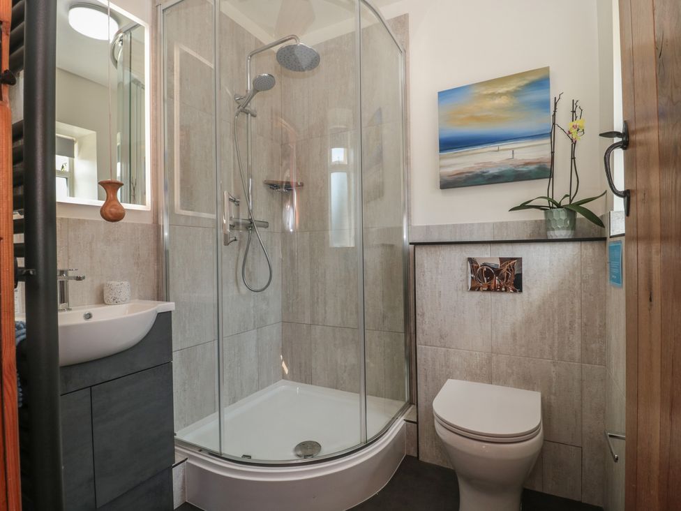 A bathroom with a shower and sink at Sunnyside in Bleadon