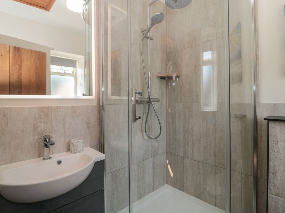 A bathroom with a shower and sink at Sunnyside Bleadon