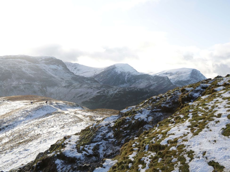 A landscape with mountains and snow at Chestnut Timber Lodge in Keswick