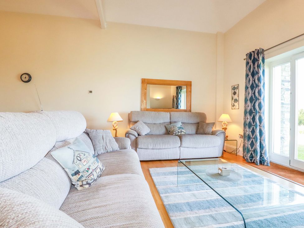 A living room with two sofas and a coffee table at Pen-Y-Les in Wadebridge