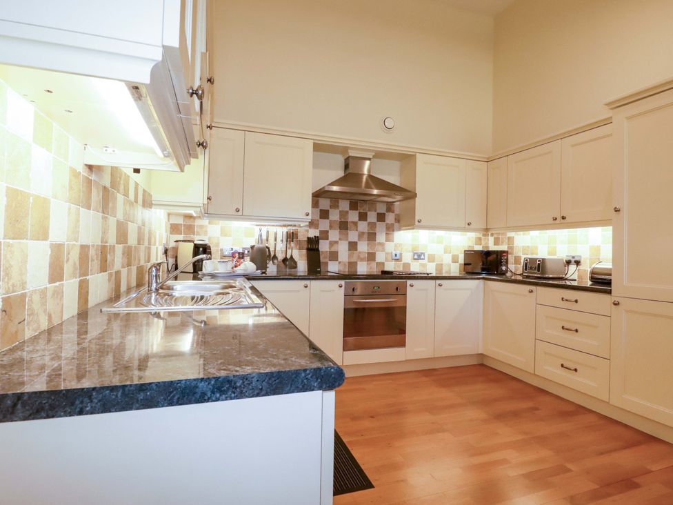 A kitchen with a stove and countertop at Pen-Y-Les in Wadebridge