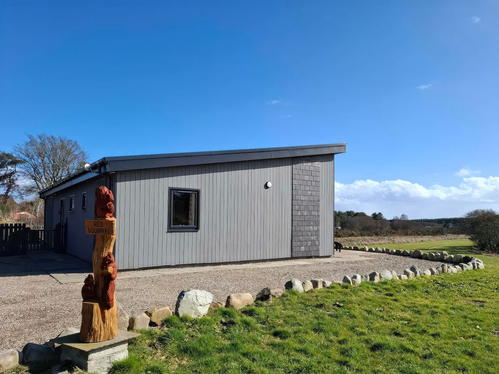 A building with a sign at Red Squirrel in Dornoch