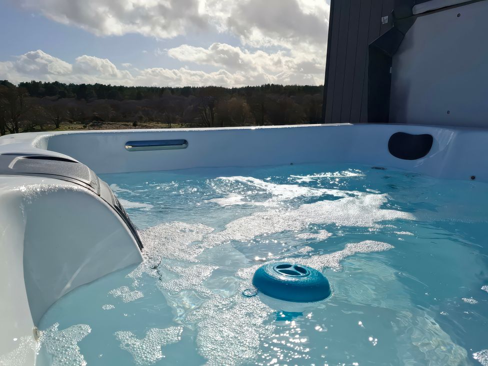 A hot tub with water and bubbles at Red Squirrel in Dornoch
