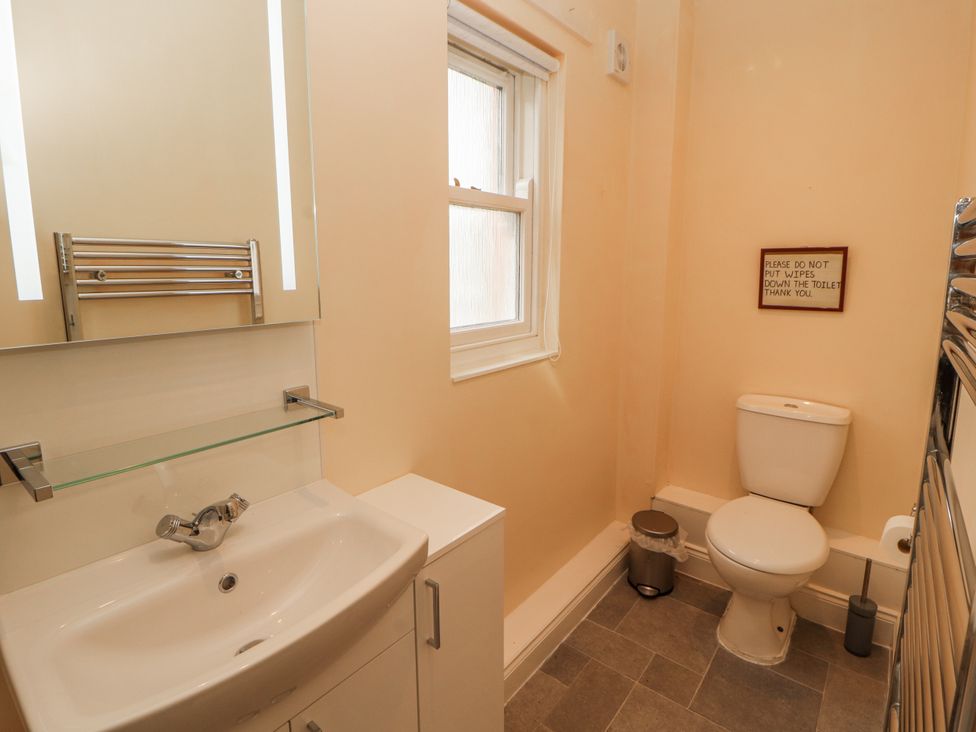 A bathroom with a sink and toilet at Flat 17 in Keswick