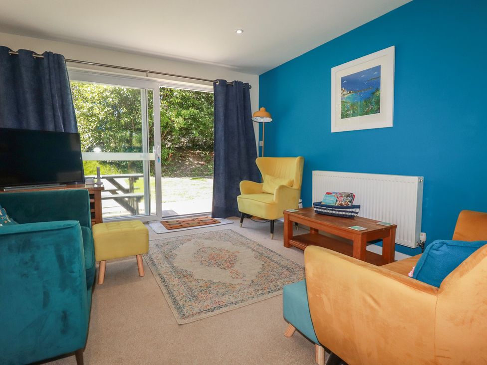 A living room with furniture including sofas and a table at 64 St Columb Nr Newquay