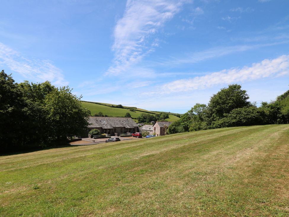 An outdoor area with buildings and cars at November Cottage in Dittisham