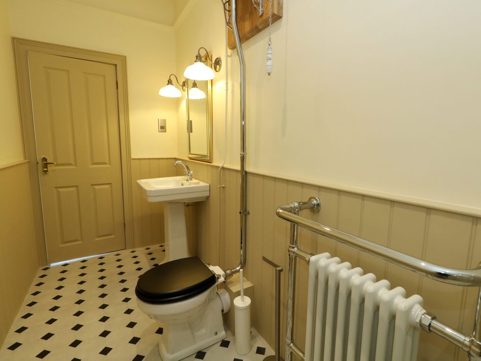 A bathroom with a sink and toilet at 123 On The Sea – Victoria’s Place in Weymouth