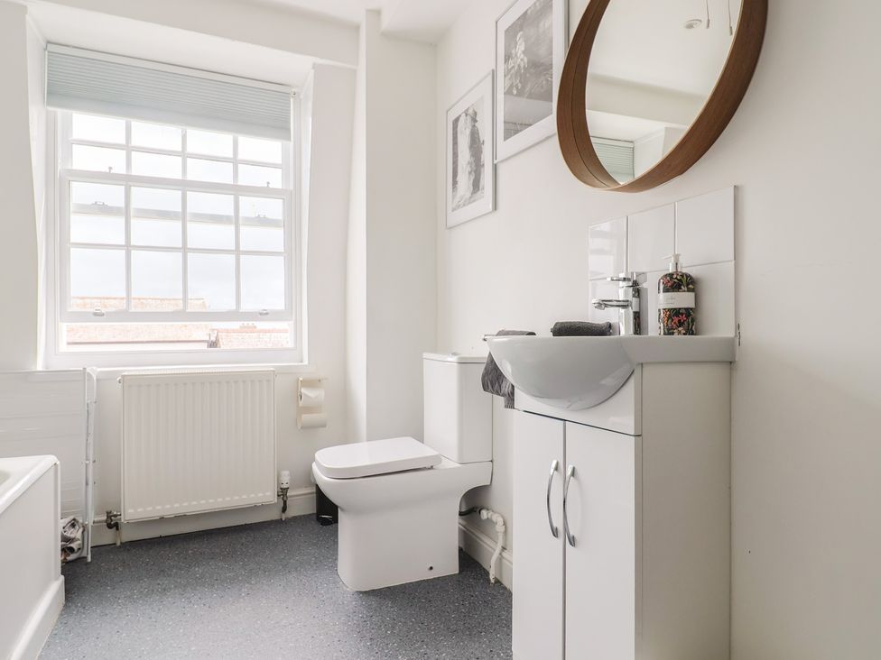 A bathroom with a sink and toilet at Jasper in Lyme Regis