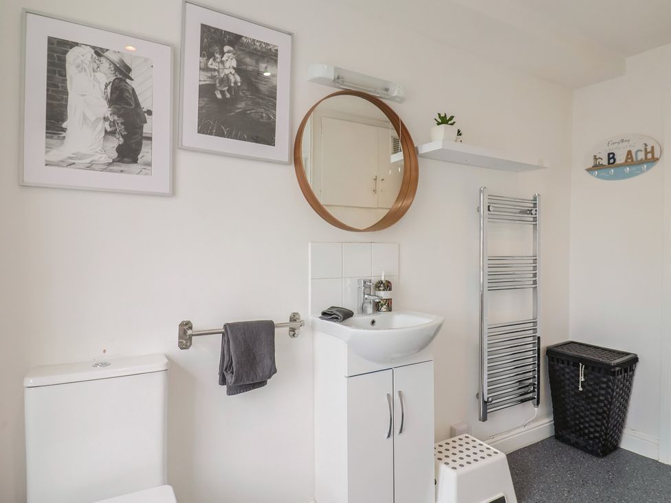 A bathroom with toilet and sink at Jasper in Lyme Regis