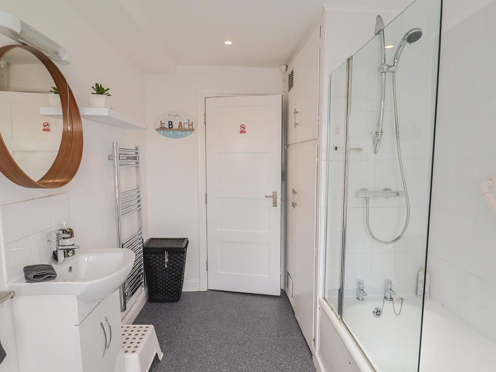 A bathroom with sink, shower, and bathtub at Jasper in Lyme Regis