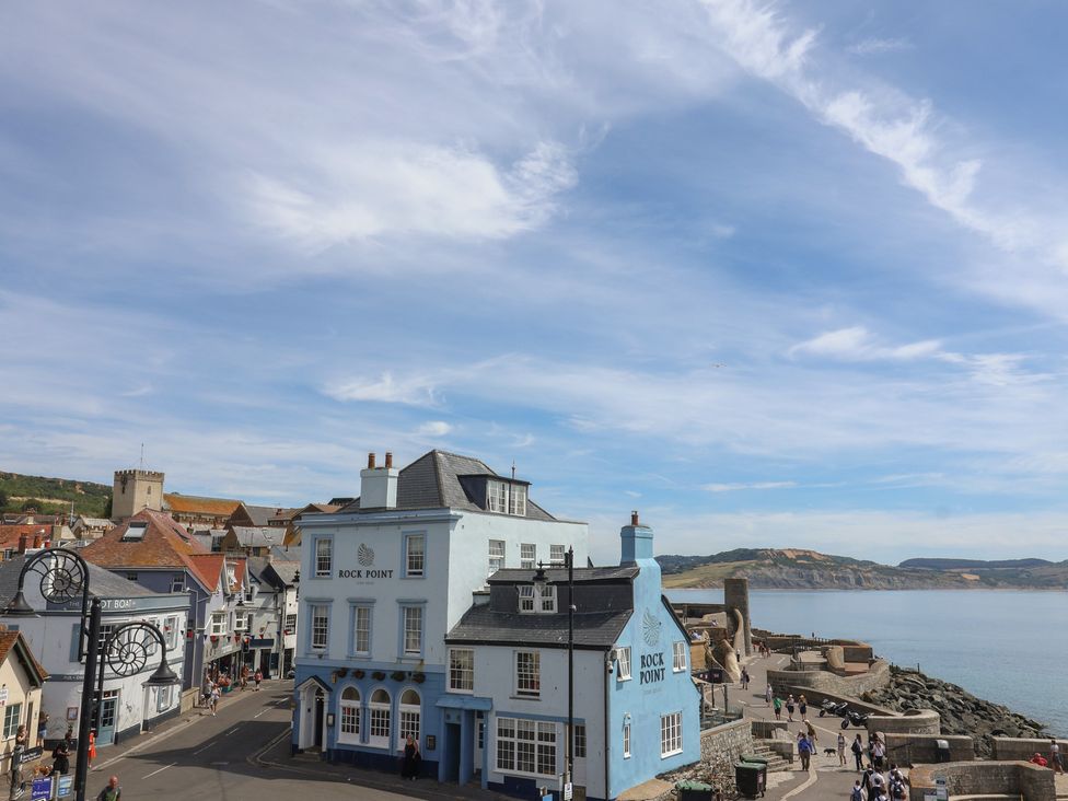 A view of Rock Point building near the coast at Jasper in Lyme Regis