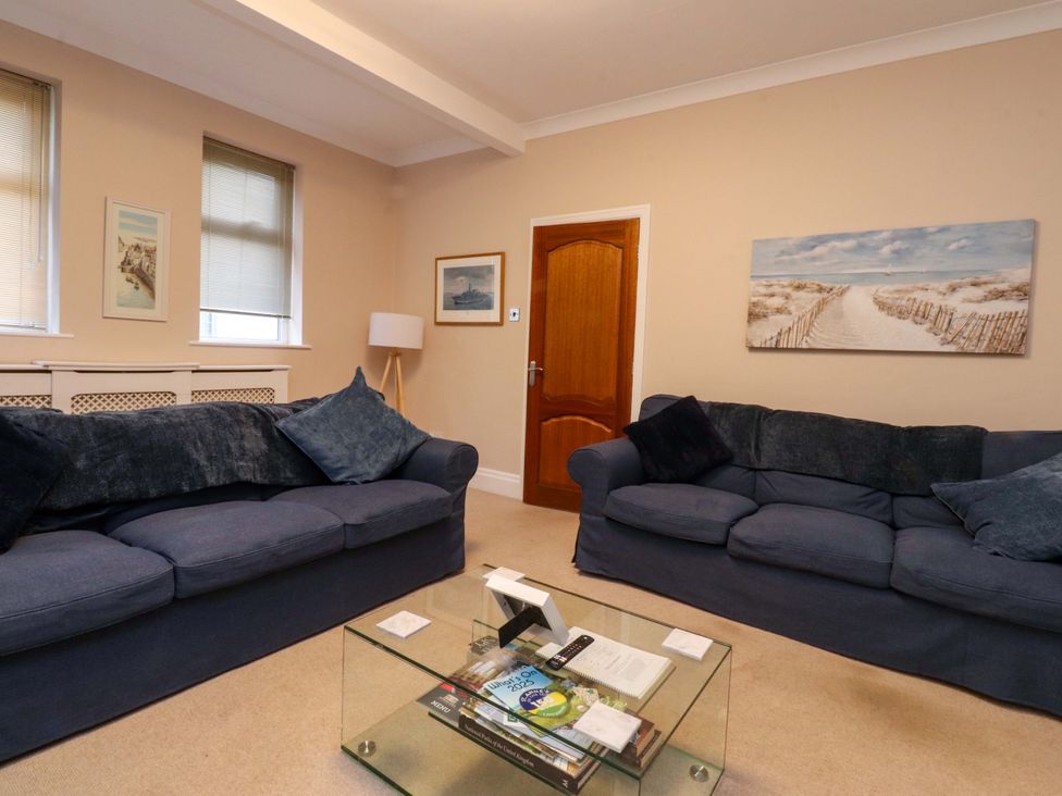 A living room with sofas and a coffee table at 6D Clifton Drive in Lytham St. Annes