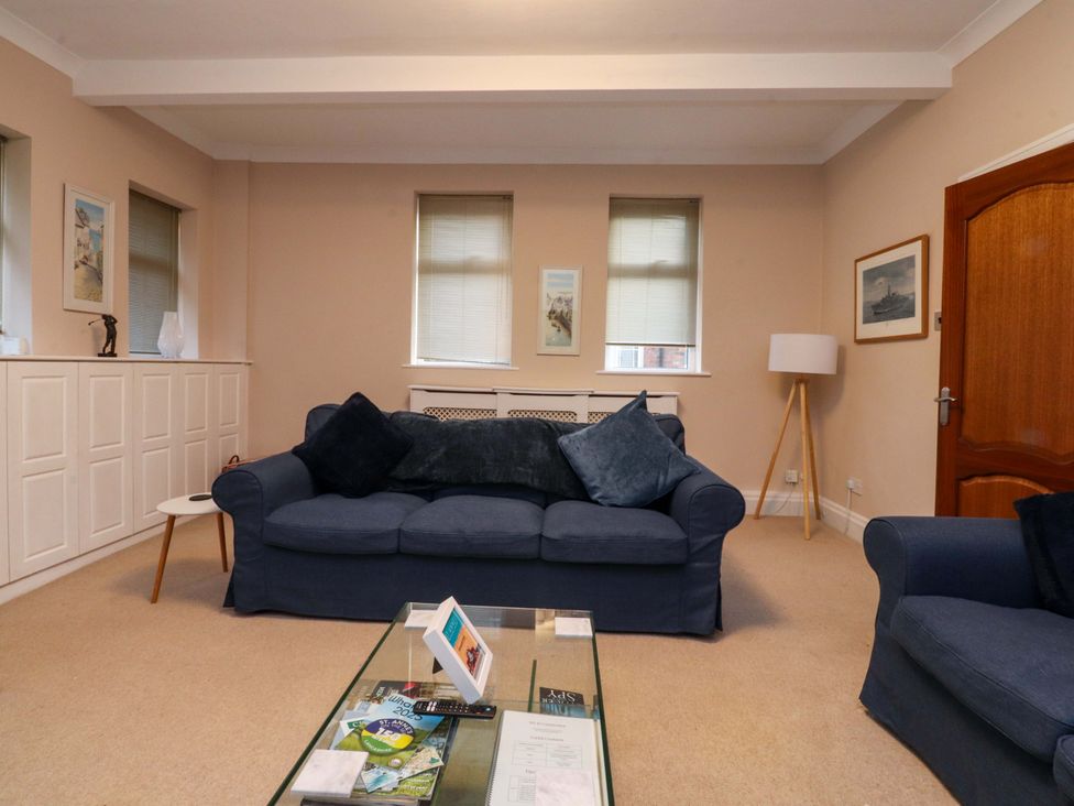 A living room with a sofa and coffee table at 6D Clifton Drive in Lytham St. Annes