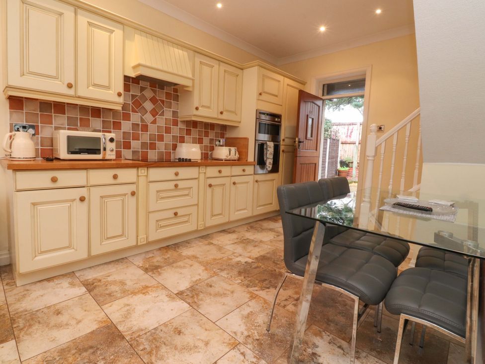 A kitchen with countertop and dining table at 6D Clifton Drive in Lytham St. Annes
