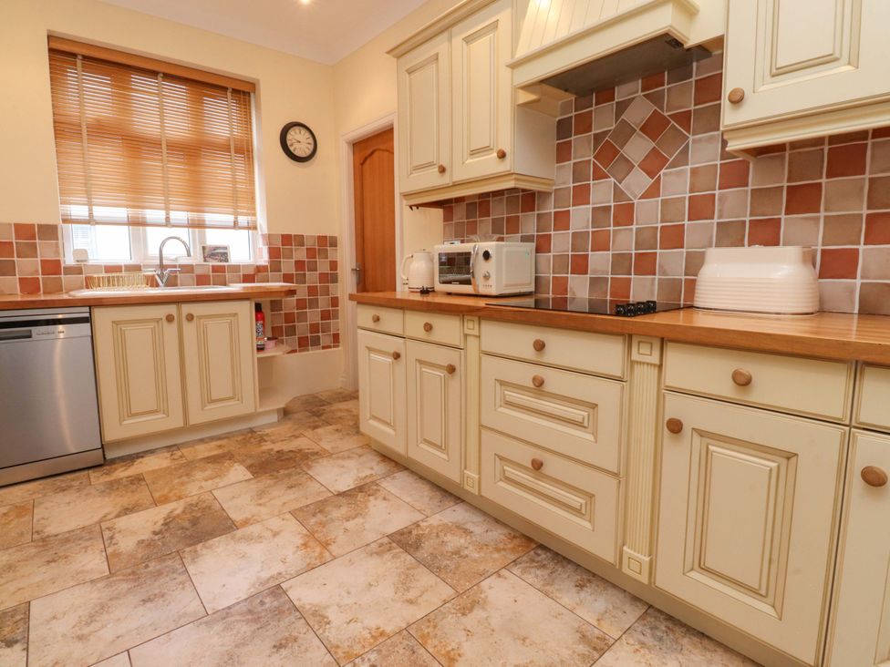 A kitchen with cabinets and appliances at 6D Clifton Drive in Lytham St. Annes