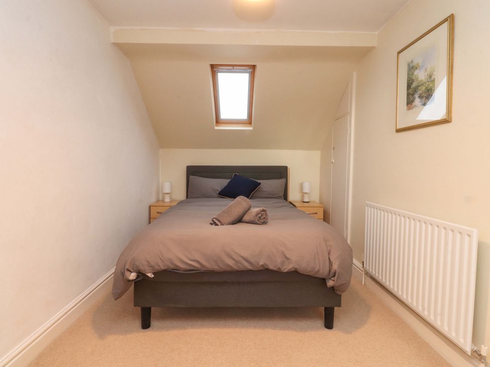 A bedroom with a bed and bedside tables at 6D Clifton Drive in Lytham St. Annes