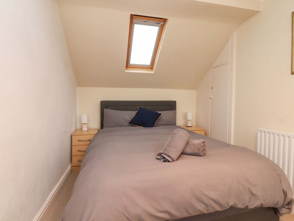 A bedroom with a bed and bedside lamp at 6D Clifton Drive in Lytham St. Annes