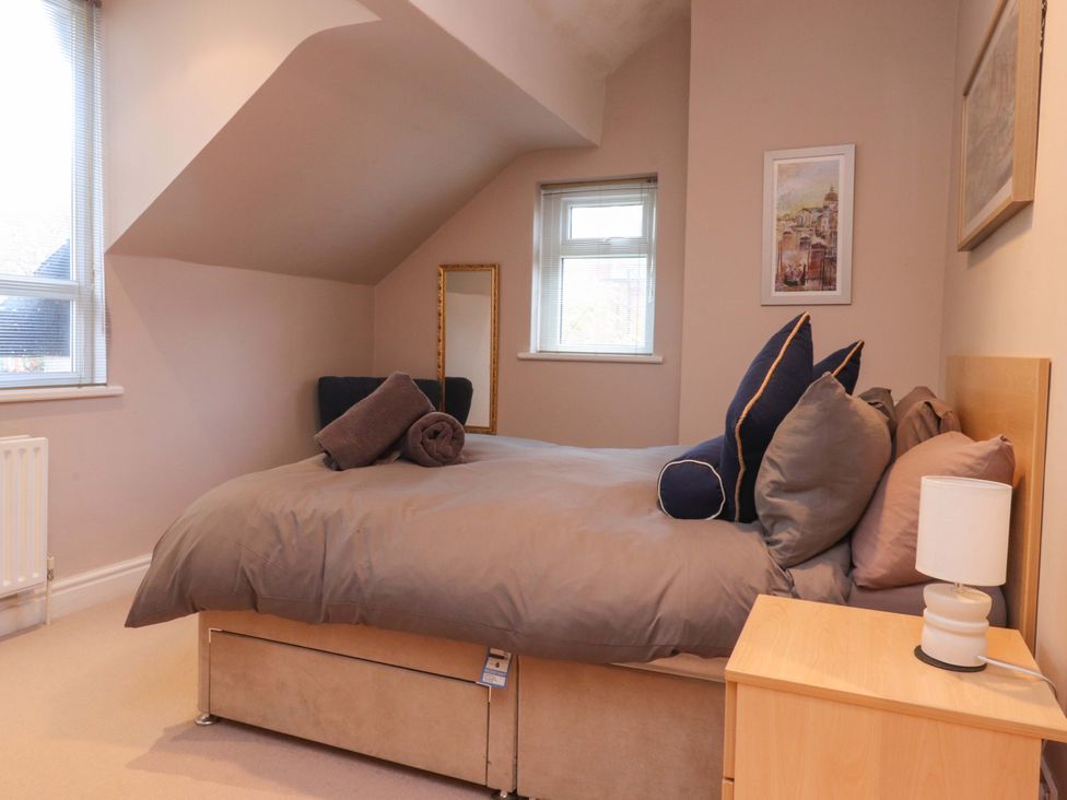 A bedroom with a bed and pillows at 6D Clifton Drive Lytham St. Annes