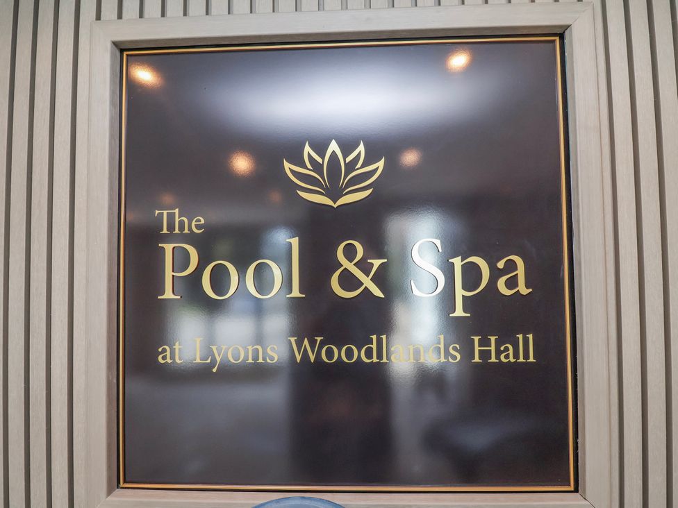 A sign for the Pool & Spa at Lyons Woodlands Hall