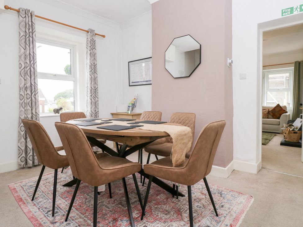 A dining room with a table and chairs at 3 Nixon Terrace Broughton Moor near Maryport