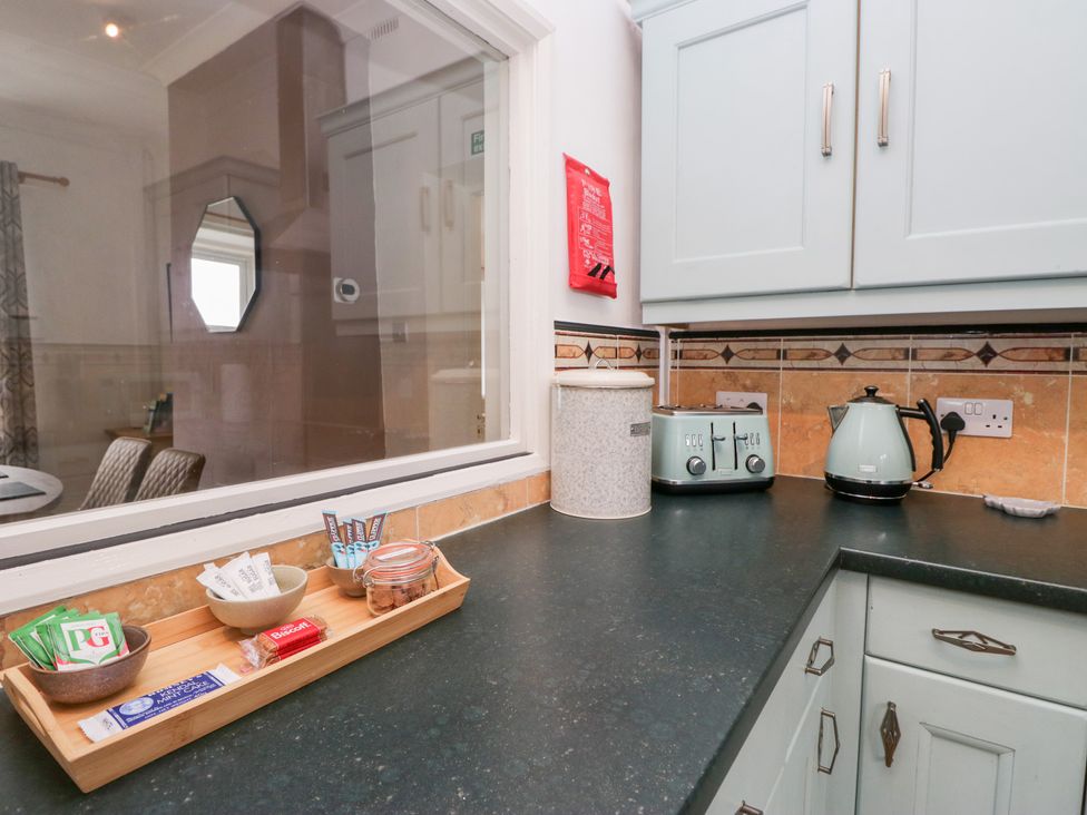A kitchen counter with a toaster and kettle at 3 Nixon Terrace Broughton Moor near Maryport